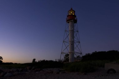 Günbatımı Pape fenerinde Letonya
