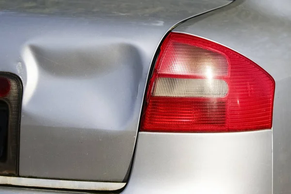 Silver car get damaged by crash accident on the road. Car repair or car insurance concept — Stock Photo, Image