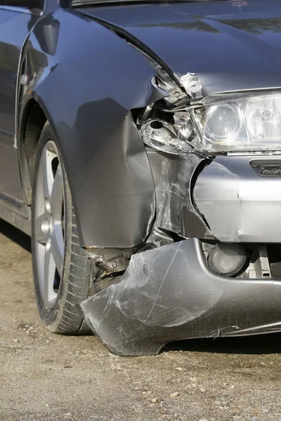 Silver car get damaged by crash accident on the road. Car repair or car insurance concept — Stock Photo, Image
