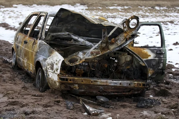 Burned car, burned-out car body, broken vehicle