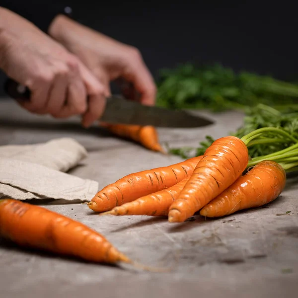 Female Hands Cutting Carrots Grey Cutting Board Focus Carrots Front — Stock Photo, Image