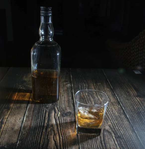 Glass Whiskey Ice Cubes Bottle Wooden Table Old Tabletop Light — Stock Photo, Image