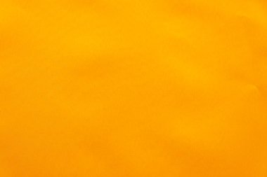 Yaratıcı turuncu arkaplan şablonu, elementler için alanı olan boş arkaplan. Kumaşın dokusu..