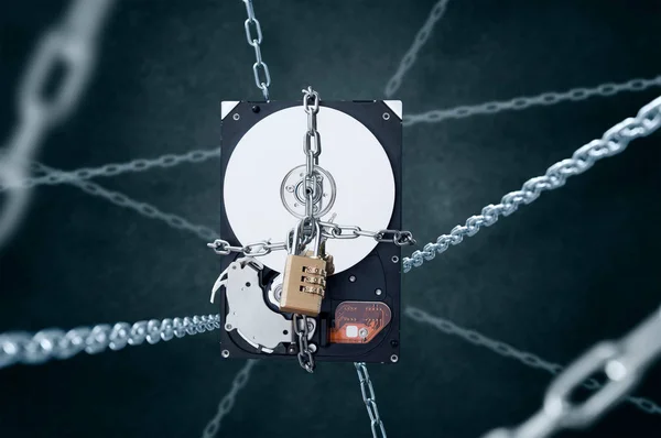 Chained hard disc drive with combination padlock — Stock Photo, Image