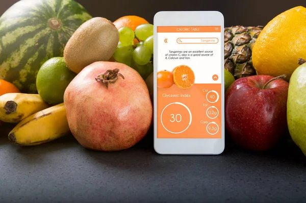 Smartphone met app toont de glycemische index. — Stockfoto