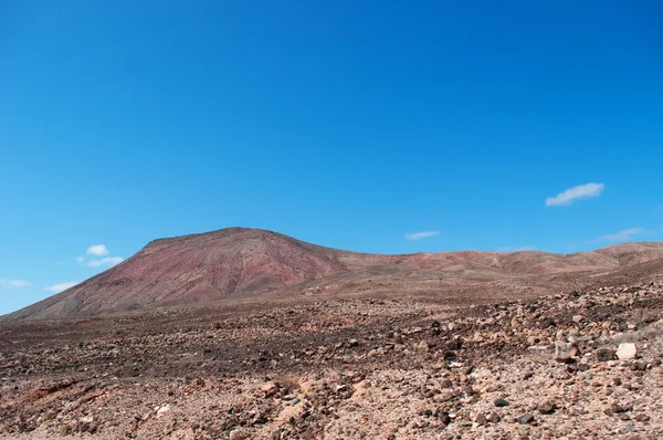 Fuerteventura, Canary Islands, Spain: aerial view of the desert landscape and the mountains seen from one of the many dirt roads crossing the island — Stock Photo, Image