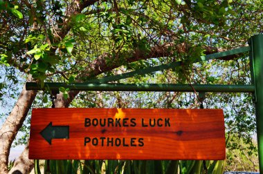 South Africa, the wooden sign to Bourke's Luck Potholes clipart