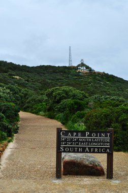Table Mountain National Park, South Africa: view of the footpath to the old Cape Point Lighthouse, built on the green Cape Point promontory in the late 1850s and closed after the sinking of the Lusitania in 1911 clipart