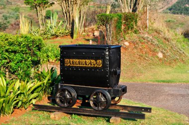 South Africa: a cart for gold on a rail in Pilgrim's Rest, a small museum town in the Mpumalanga province, provincial heritage site, which was the second of the Transvaal gold fields attracting a rush of prospectors in 1873 clipart