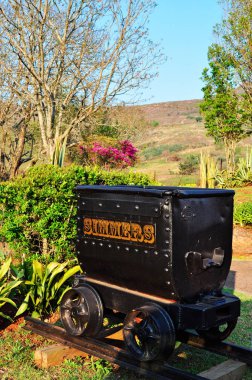 South Africa: a cart for gold on a rail in Pilgrim's Rest, a small museum town in the Mpumalanga province, provincial heritage site, which was the second of the Transvaal gold fields attracting a rush of prospectors in 1873 clipart