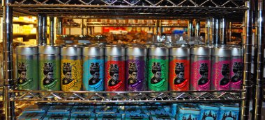 Cape Town, South Africa: shelves with a row of cans of different flavors of African tea coming from the main African cities  clipart