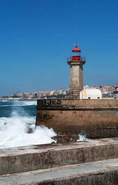 Porto, Portugal: view of the pier and the Farolim de Felgueiras, the Felgueiras Lighthouse, built in 1886 on the right bank of the Douro River and located in the parish of Foz do Douro Royalty Free Stock Images