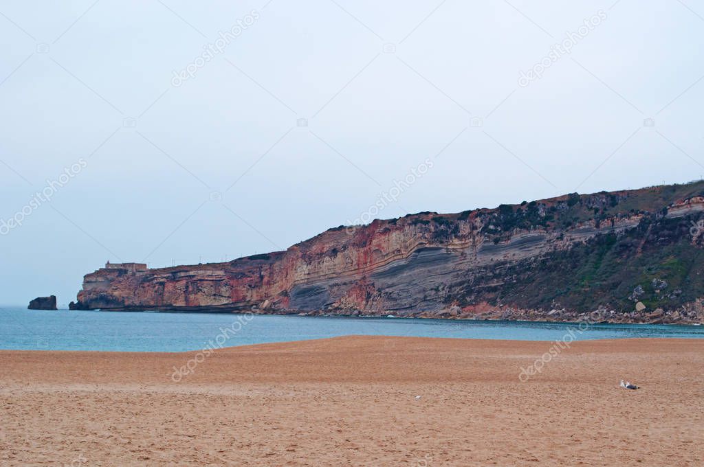 Portugal: view of the beach and the neighborhoods Praia and Pederneira and the view of Sitio, the other old neighborhood of the town of Nazare perched on a cliff