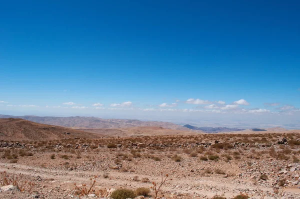 Jordan: jordanian landscape and desert on the road to the Wadi Rum, known as Valley of the Moon, a famous worldwide valley cut into the sandstone and granite rock and looking like the planet of Mars