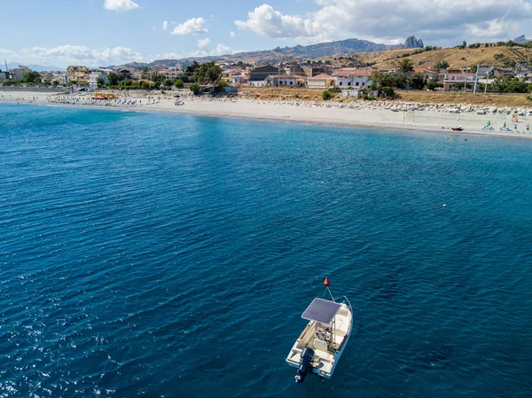 Aerial view of boats moored in Melito di Porto Salvo, coast and hills of Calabria. Italy