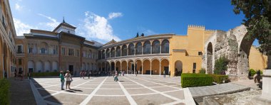 Spain: the Mudejar Palace of Pedro I, designed in Moorish style for a Christian ruler, in the Patio de la Monteria (the Hunting Courtyard) of the Alcazar of Seville, the famous royal palace clipart