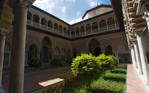 Spain: view of the Patio de las Doncellas, the Courtyard of the Maidens, the center of the public area of the King Peter I Palace in the Alcazar of Seville, the famous royal palace 