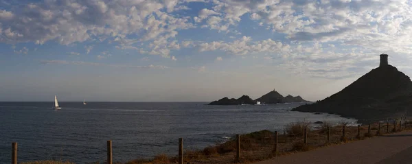 Corsica: sunset on La Parata Tower, ruined Genoese tower built in 1608 on the top of La Parata Cape at the northern end of Ajaccio Gulf, with view of the Iles Sanguinaires (Bloody Islands) — Stock Photo, Image