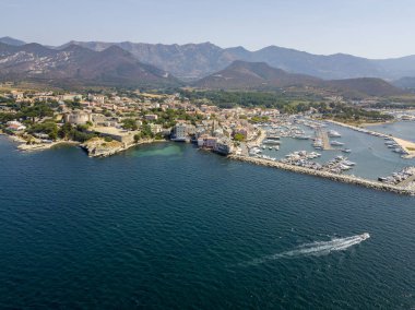 Aerial view of the village of Saint Florent, Corsica. France. Harbor boats and houses clipart