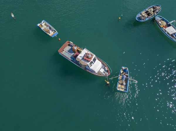 Aerial view of a Man in a boat rowing among the boats moored in a harbor. 07/06/2017. Vibo Marina. Calabria, Italy