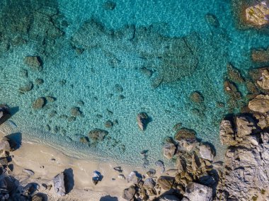 Aerial view of Tropea beach, crystal clear water and rocks that appear on the beach. Calabria, Italy. Swimmers, bathers floating on the water. Coastline of Calabria clipart