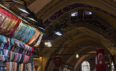 Istanbul, Turkey, Middle East: turkish flag, fabrics and ceiling decoration in the Grand Bazaar, one of the largest and oldest covered markets in the world with 61 covered streets and over 4,000 shops, city top attraction