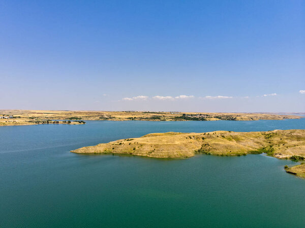 Aerial view of rural and agricultural areas south of Lokman in the province of Adiyaman, Turkey. Inlets on the Euphrates river formed by the Ataturk dam. Desert lands