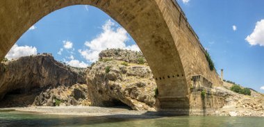 Panoramic view of the Severan Bridge, Cendere Koprusu is a late Roman bridge, close to Nemrut Dagi and Adiyaman, Turkey. Roadway flanked by ancient columns of Roman Emperor Lucius Septimius Severus clipart
