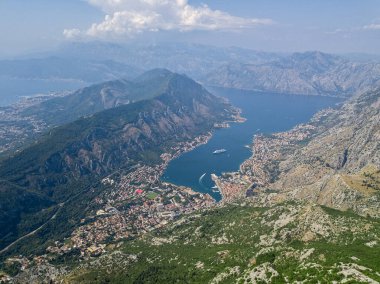 Aerial view of the Bay of Kotor, Boka. Old city of Kotor, fortifications. Mountain of St.John and the fortress. Tourism and cruise ships. The bay is the largest fjord in the Mediterranean. Montenegro