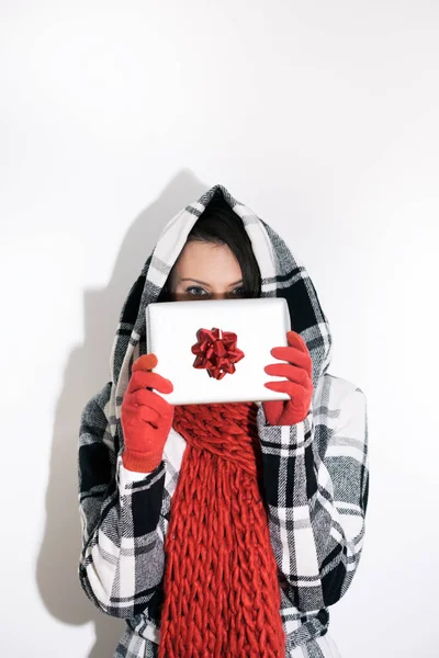 Woman Peeks Over Christmas Present — Stock Photo, Image