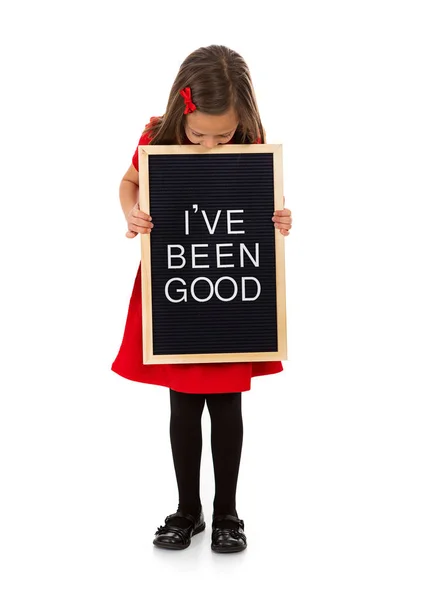 Weihnachten: Mädchen mit Zeichen, dass es ihr gut geht — Stockfoto
