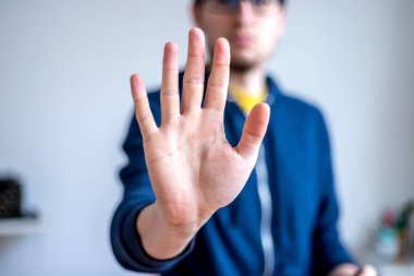 Defense or stop gesture: Male hand with stop gesture