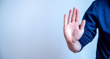 Defense or stop gesture: Male hand with stop gesture