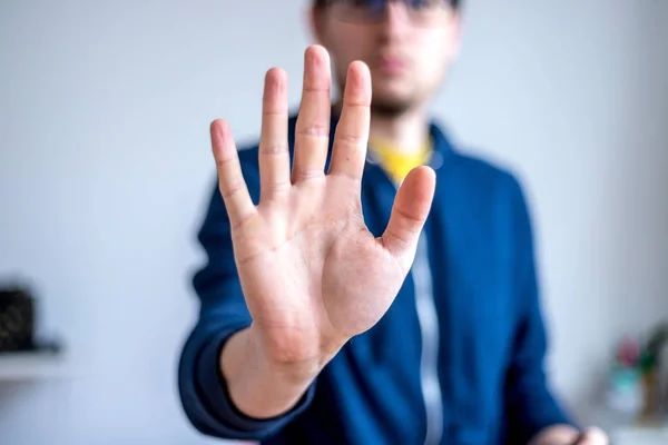 Defense or stop gesture: Male hand with stop gesture — Stockfoto