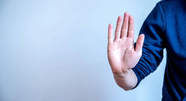 Defense or stop gesture: Male hand with stop gesture — Stockfoto