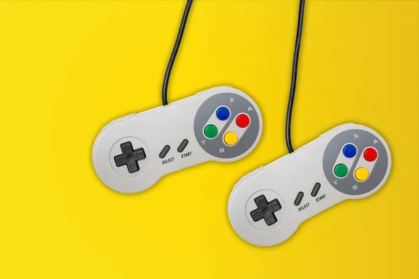 Abstract Retro Computer Gaming Controller Yellow Background — Stock Photo, Image