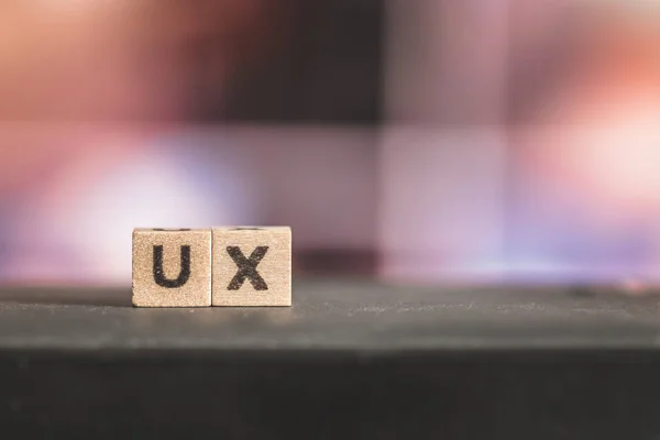 Wood cubes with the word ux,  picture with copy space