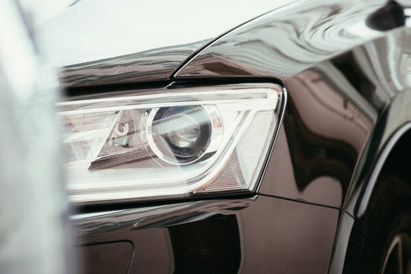 Close up of modern led car headlights, mobility