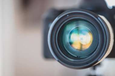 Close up of professional photo camera on a tripod, lens clipart