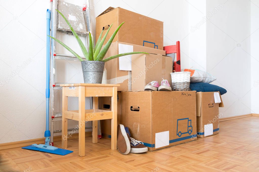 Move. Cardboard boxes, cleaning stuff and things for moving into a new home  