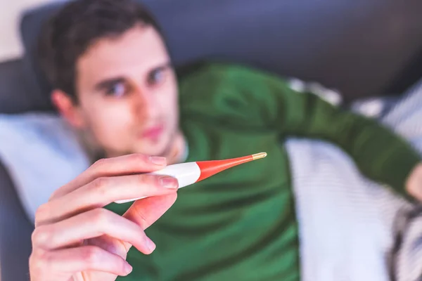 Man Holding Red Fever Thermometer His Hand — Stock Photo, Image