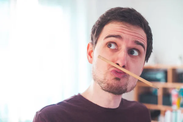 Young Caucasian Man Fooling Home Pencil Trapped Nose Lips — Stock Photo, Image