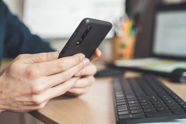 Young Man Holding Mobile Phone His Hands Indoor Home Office — Stock Photo, Image