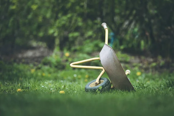 Tipped Child Hand Barrow Green Garden — Stock Photo, Image