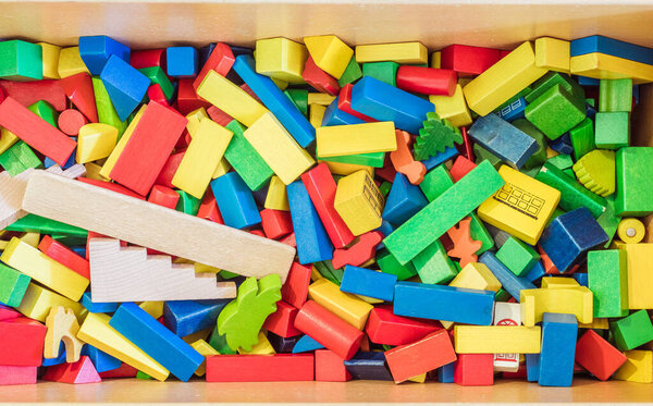 Colorful wooden toy blocks in a box