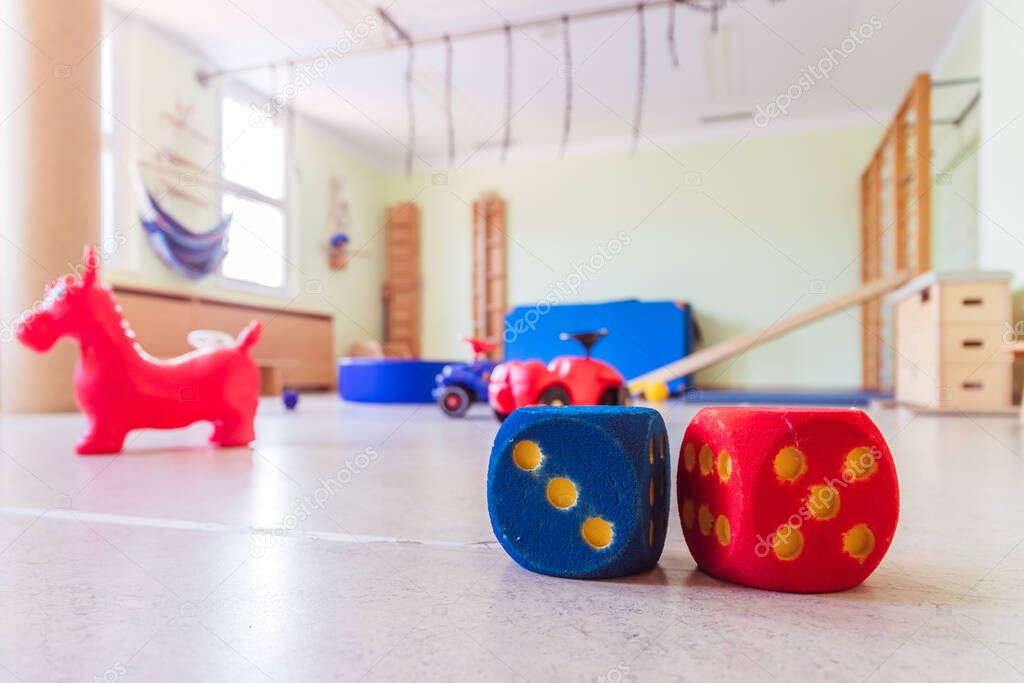 Close up of toy foam cubes in a gym hall of a Kindergarten