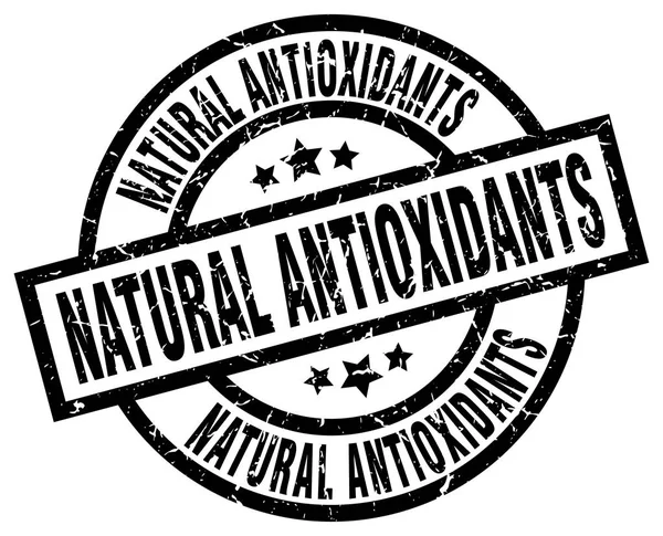 Natural antioxidants round grunge black stamp — Stock Vector