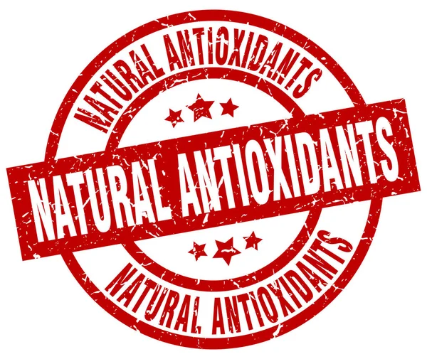 Natural antioxidants round red grunge stamp — Stock Vector