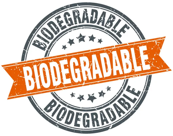Biodegradable round grunge ribbon stamp — Stock Vector