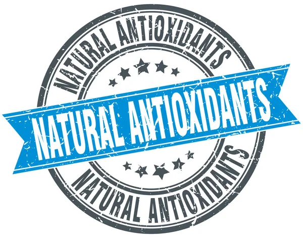 Natural antioxidants round grunge ribbon stamp — Stock Vector